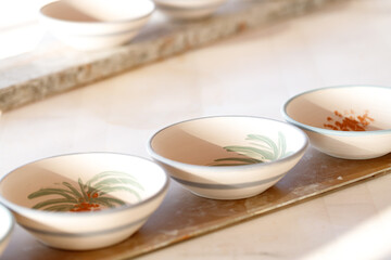 Pottery in creative workshop, store and manufacturing startup. Ceramics, collection and display in studio,  retail craft market