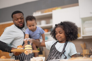 Family baking together in the kitchen creating memories with flour and smiles