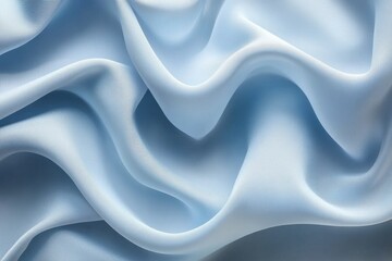 Obraz premium Soft, light blue silk fabric drapes elegantly. Ideal for fashion, beauty, or luxury product backgrounds.
