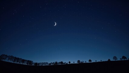A captivating close-up from below reveals a silver crescent moon reigning over a midnight-blue sky speckled with twinkling stars, positioned elegantly at its heart