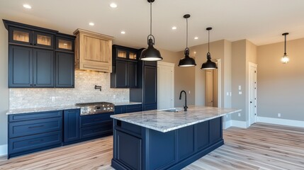 Navy blue kitchen cabinets with a subtle matte finish, sleek marble countertops, and reclaimed oak floors