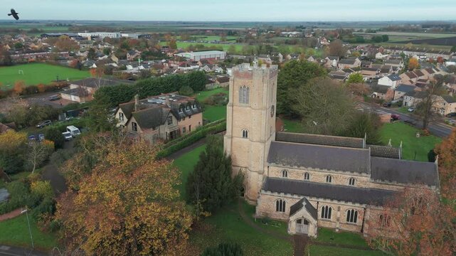Littleport church with surrounding village, captured on an autumn day, aerial view