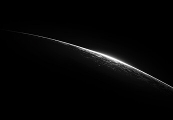 thin crescent of light on a dark planetary horizon