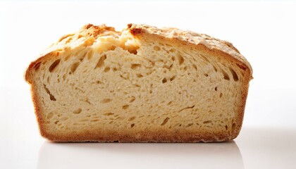 Half of a loaf of freshly baked bread, golden-brown crust and airy crumb.
