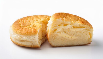 Golden-brown baked treat with creamy filling, cut in half, on a white background.