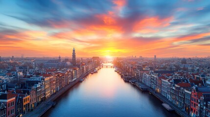 Fototapeta premium Stunning sunset over a city canal, showcasing vibrant colors.