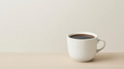 Obraz premium Freshly Brewed Black Coffee in a Simple White Cup on Wooden Table