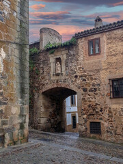 Fototapeta premium The Arch of Santa Ana, gateway to the walled city of Cáceres.