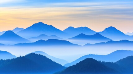 Fototapeta premium Serene mountain landscape with layered blue hues at dawn.