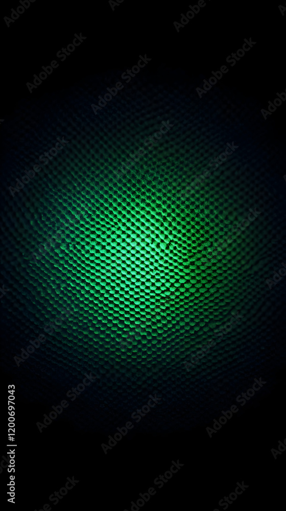 Poster illuminated green textured surface with cellular pattern in dark background