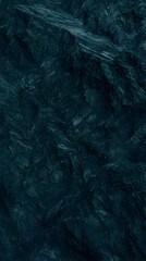 Naklejka premium Dark Teal Rock Formation Creates a Rugged Textured Landscape Background