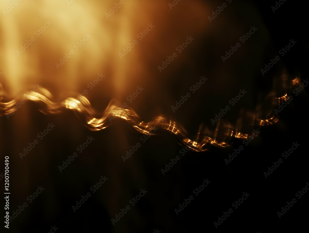 Poster abstract golden light wave flows smoothly across a dark background with soft focus effect.