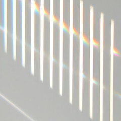 Obraz premium Light Creates Rainbow Prisms through Vertical Slats Beautifully on a Wall