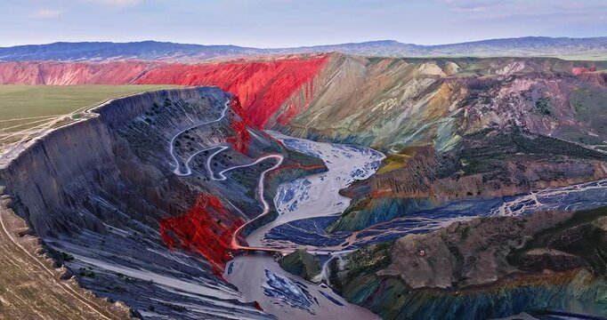 Aerial view of spectacular canyon and river natural landscape at dusk. Beautiful Anjihai Grand Canyon geological scenery in Xinjiang, China.