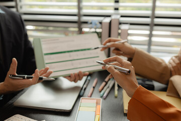 Several employees work together in a company, A group of business people sit together and discuss and exchange ideas about the content of the work, colleagues planning together in the office