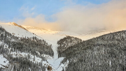 Winter Sunset on I-70 in Colorado, Traveling along I-70 in Colorado during the Winter, between Vail...
