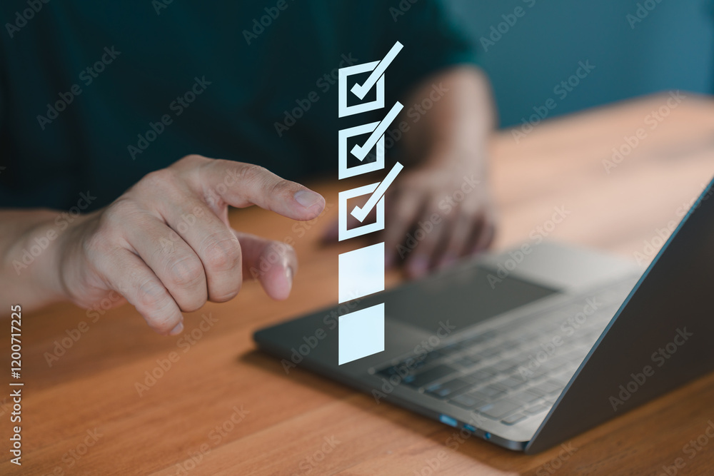 Poster Male hand pointing at a virtual checklist with completed tasks on a laptop, symbolizing task management, service, quality control, productivity, and efficient work processes in a digital environment.
