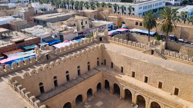 View from the Ribat of Sousse, overlooking the courtyard of the historic building and the modern city center on a sunny morning in Tunisia
