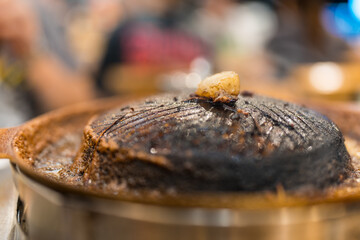 Dirty iron pan for barbeque burn skillet and without soup after eating Moo krata.