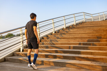Young man running on the steps