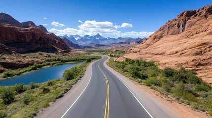 Winding road through mountains with scenic views and blue sky