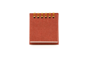 Blank red desk calendar isolated on white background. Blank paper desk spiral calendar. Copy Space and clipping path.