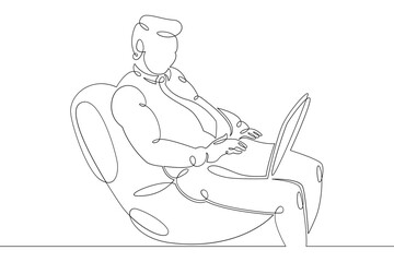 Young man sits working at a laptop computer. Designer manager works on the Internet. One continuous drawing line, logo single hand drawn art doodle isolated minimal illustration.