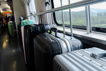 Suitcases in the train aisle