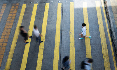 People are walking on pedestrian crossing