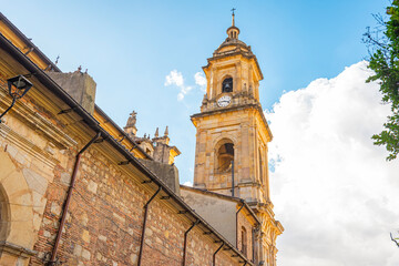 Historic Clock Tower in Bogotá's Candelaria, Showcasing Colonial Architecture Against a Blue Sky