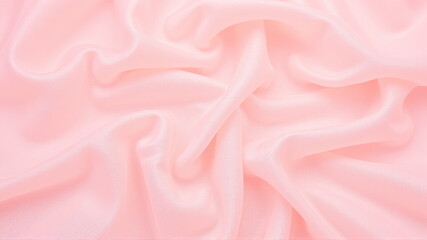 Obraz premium Soft pink silk fabric texture with gentle folds