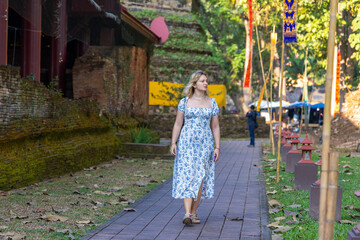 A young female tourist in the ancient city Chiang Saen in Thailand