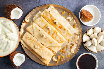 Pitha Pulli is a traditional Bengali sweet made with rice flour, jaggery, coconut, and spices, often steamed or fried.