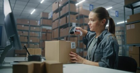 Female logistics specialist scans parcel with barcode scanner, checks data using computer. African American sorting center employee working with boxes for shipping. Load department of postal service.