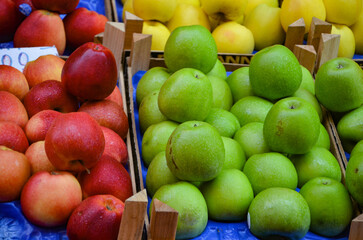 red and green ripe apples at a market in Catania, Sicily
