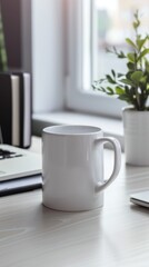 White Coffee Mug on Wooden Desk with Laptop and Green Plant