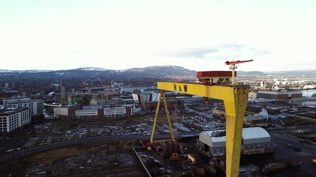 Aerial shot of Samson and Goliath, the Harland and Wolff Cranes on a winter day in Belfast, Northern Ireland. The camera travels from right to left. Shot in 4K, 30fps and in Rec709 color.