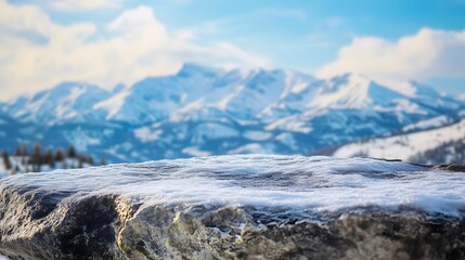 Snow Covered Rock Overlooking Winter Mountain Range