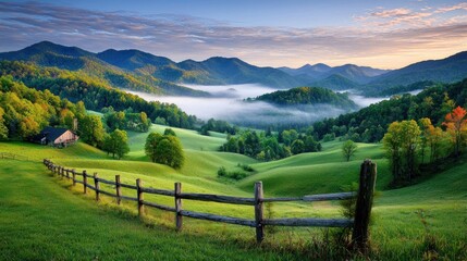 Serene landscape with rolling hills, mist, and a wooden fence.