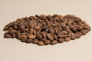 A high-quality photograph of carefully selected coffee beans, showcasing their rich texture and natural colors. Perfect for use as a background in designs, advertisements for coffee shops, cafes, or o