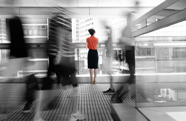 Woman standing on footbridge and thinking