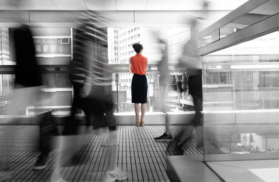 Woman standing on footbridge and thinking - Powered by Adobe