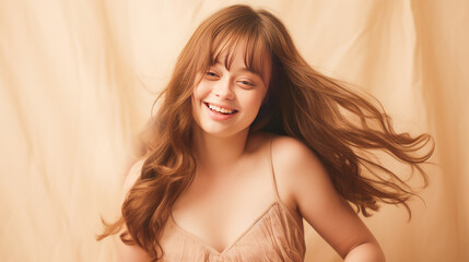 Naklejka premium Portrait of smiling laughing woman with Down syndrome creamy beige background.