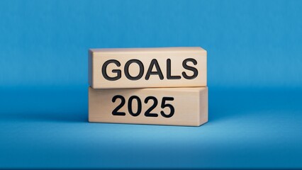 2025 Happy New year banner. Text GOALS, 2025 numbers and target icon on wooden cube blocks. Business goal plan and achievement concept.3D rendering on blue background.