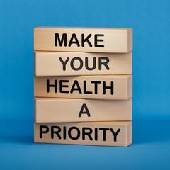 Obraz premium Health symbol. Wooden blocks with words Make your health a Priority.Health concept. Copy space.3D rendering on blue background.
