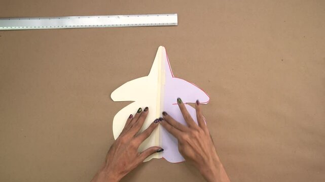 Abstract cardboard cutout on plain surface, artistic design concept in crafting
