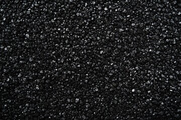 Black background with small particles of sand or dust for a design template, print, and texture