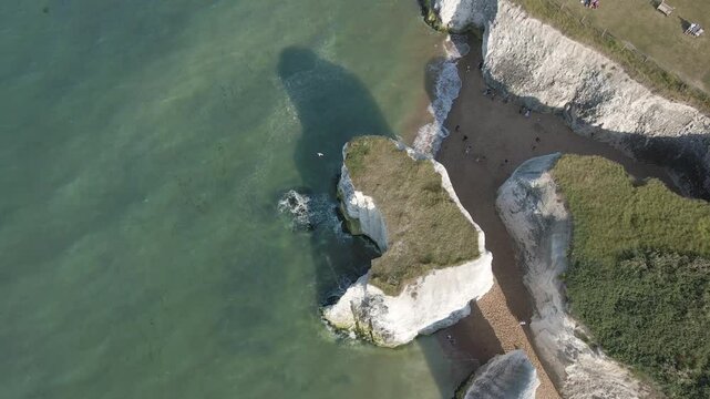 Botany Bay coastline. High aerial drone footage of the sea and beach. Slowly increasing altitude. 7 of 14