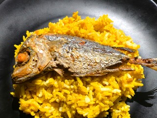 Fried mackerel fish on rice, in door  Chiangmai  Thailand.