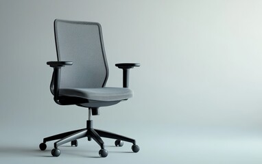 A sleek gray office chair with a mesh back and ergonomic design, isolated on a white surface